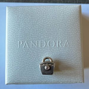 Pandora purse charm with pink “jewel/crystal”
